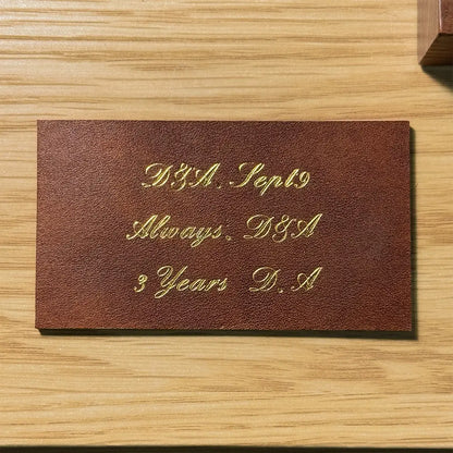 Custom gold foil embossing for a 3rd leather anniversary gift option, handcrafted by Longisland Leather in Calgary, Alberta.