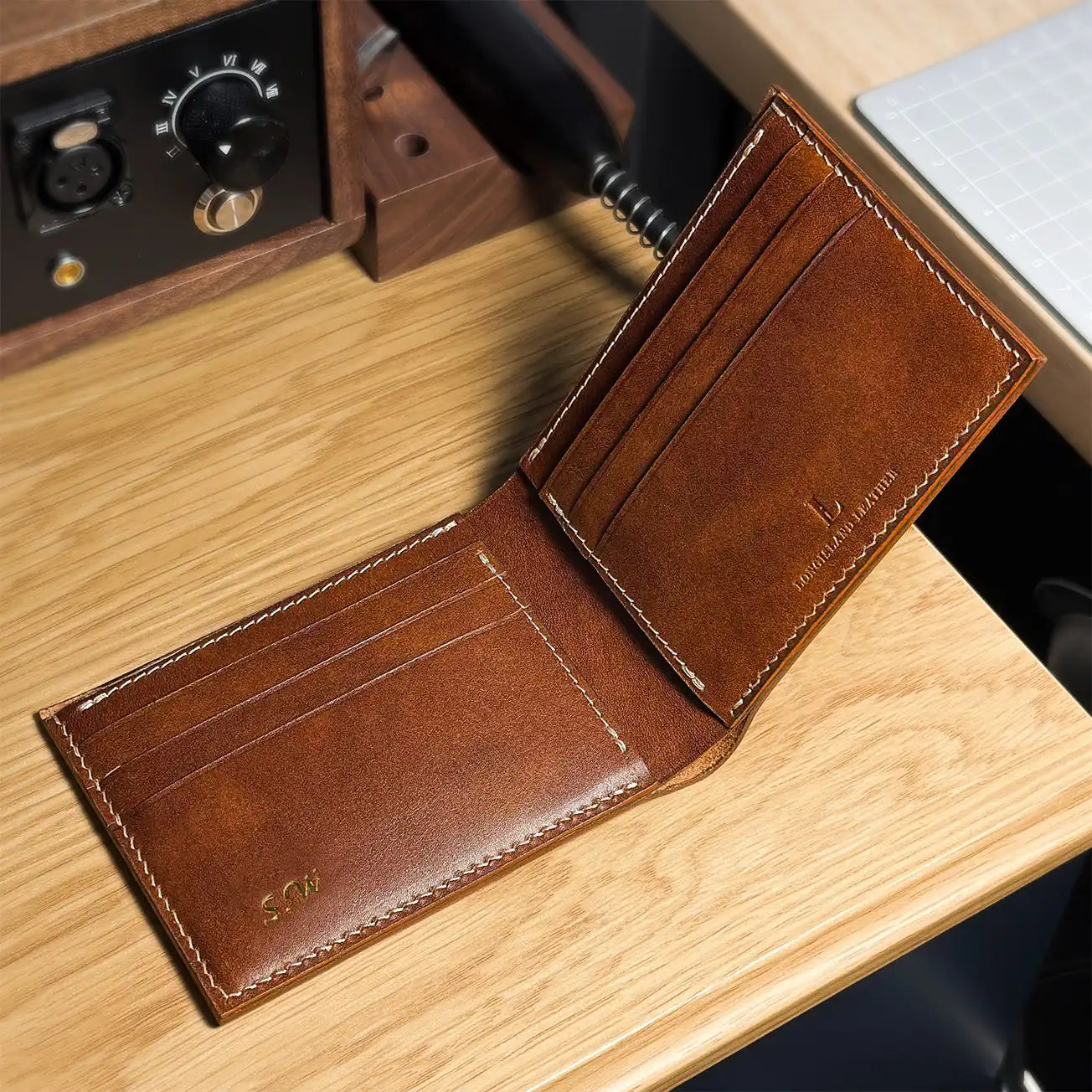 Interior view of a handcrafted classic bifold leather wallet with personalized names, made in Calgary.
