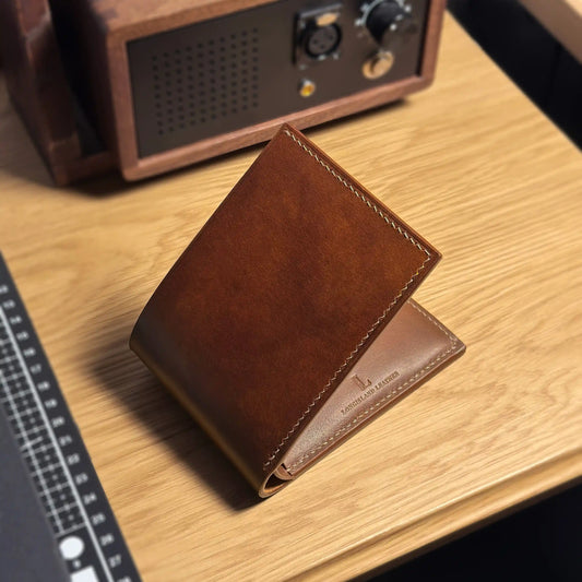 A classic handmade leather wallet for men, showcasing the premium Italian vegetable-tanned leather finish.