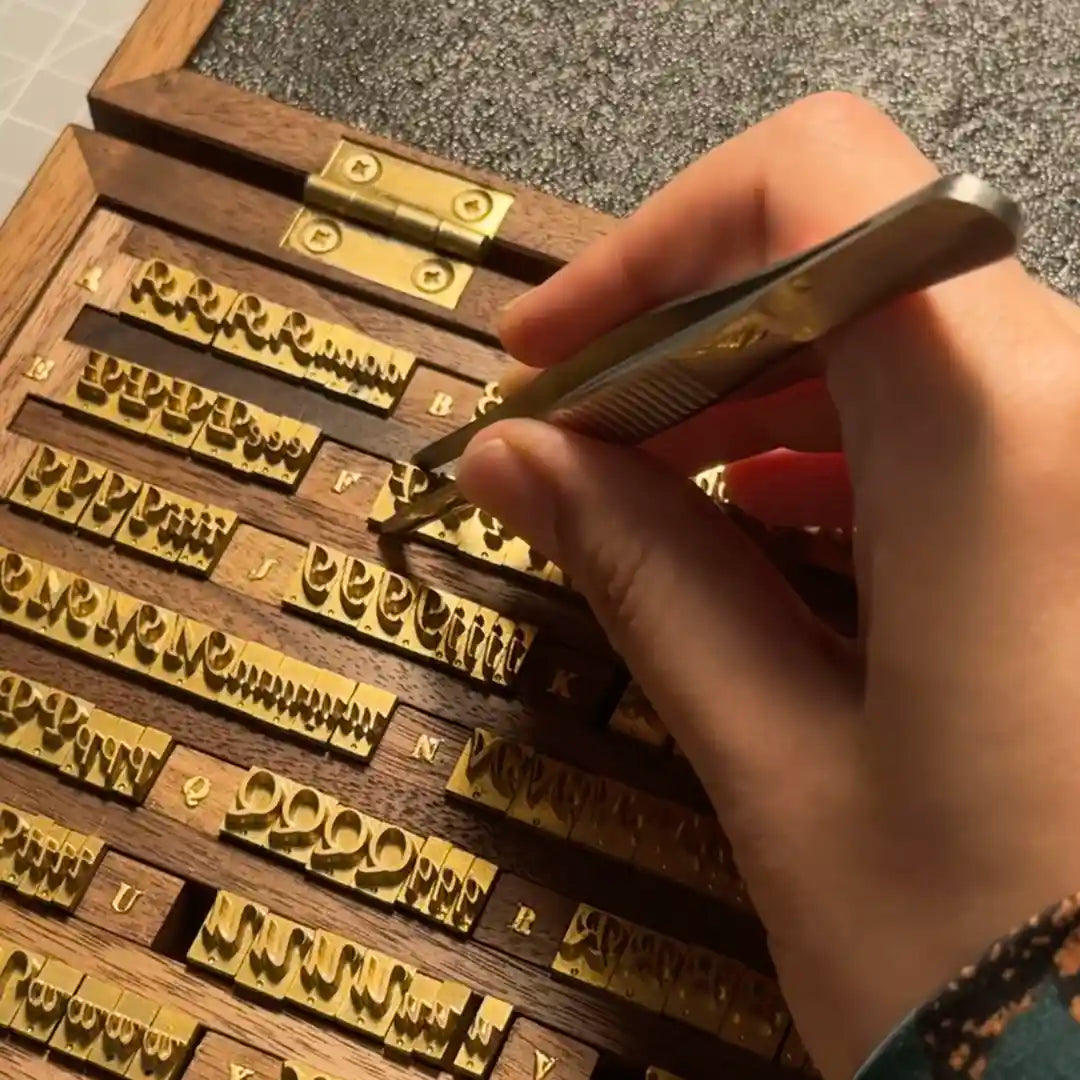 Personalizing with traditional gold foil stamping or engraving in Calgary studio.
