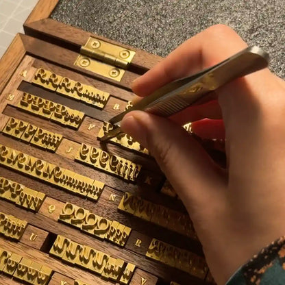 Personalizing with traditional gold foil stamping or engraving in Calgary studio.