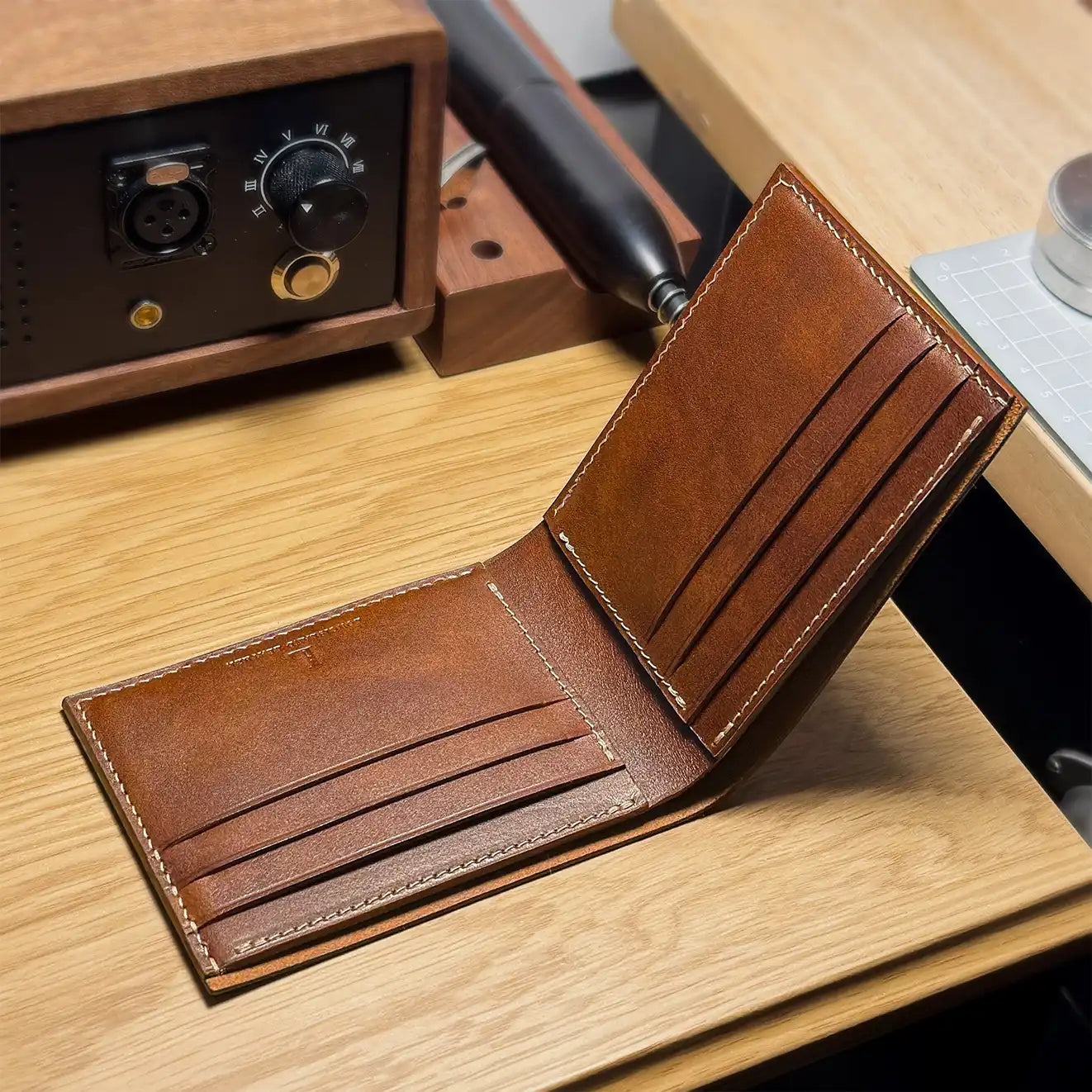 Inside view of the classic vegetable-tanned bifold wallet showing 8 card slots and premium finish.