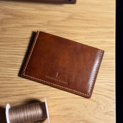 Back view of Longisland Leather everyday card holder featuring the brand's embossed logo.