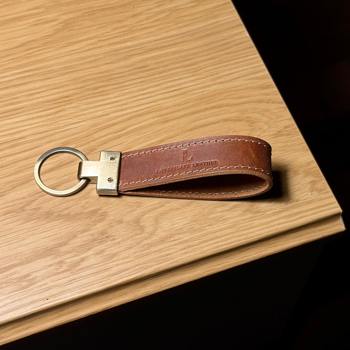 Back of LOOP leather key fob showing Longisland Leather logo and metal key ring