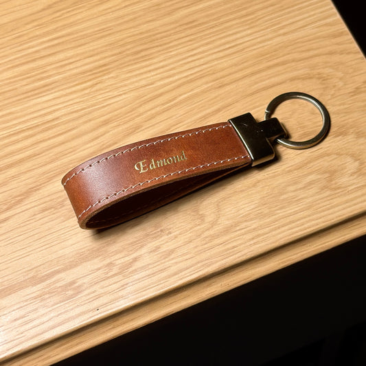 LOOP brown leather keychain with personalized gold name stamping and stitched edges