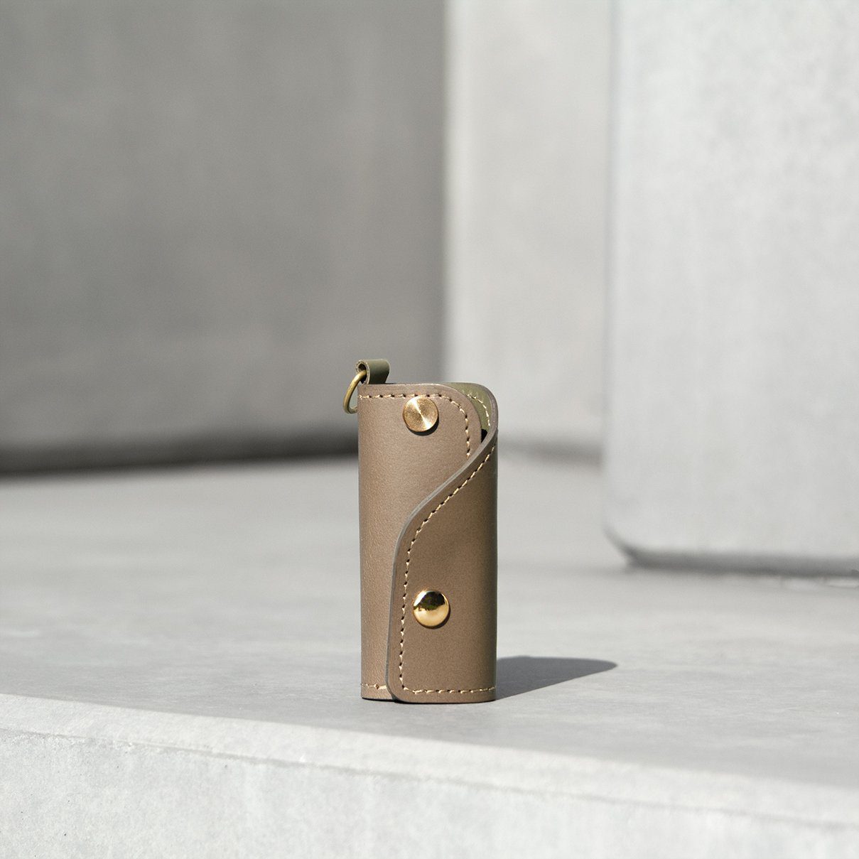 The SIDECAR custom leather key case in elephant grey, a slim and durable key holder for personalized gifts